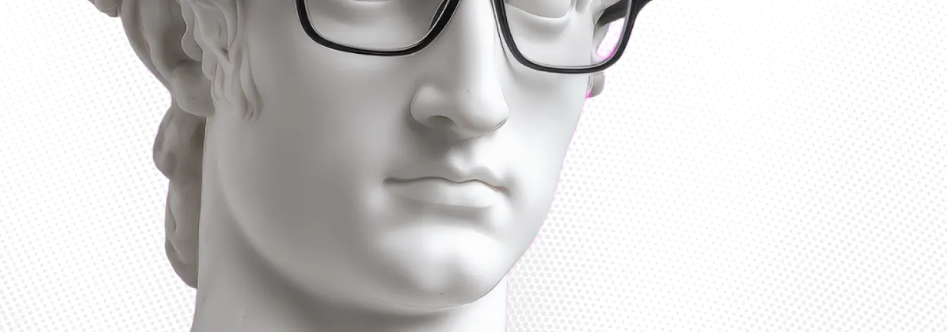 greek bust wearing black rimmed glasses