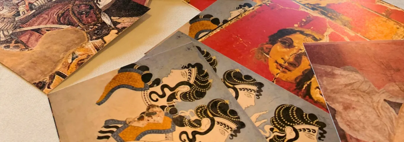 a table of postcards with Greek and Roman art