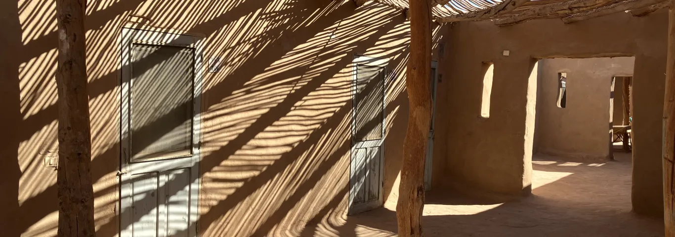 shadows drop on an outdoor desert room