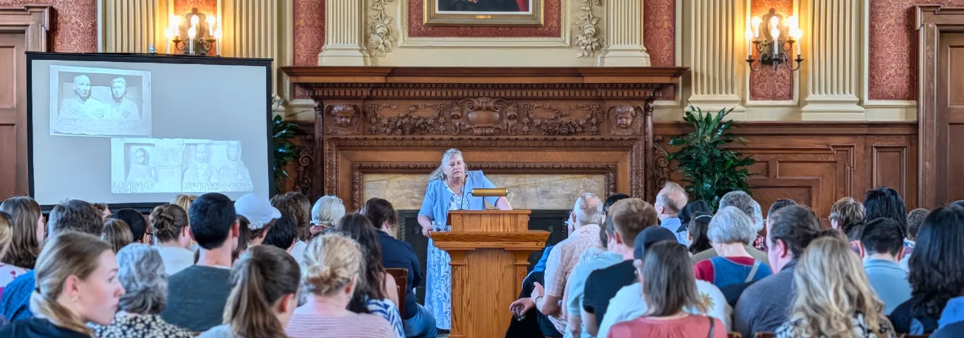 Meyer in front of lecture audience