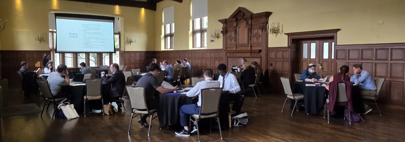 Image of a conference presentation with the crowd