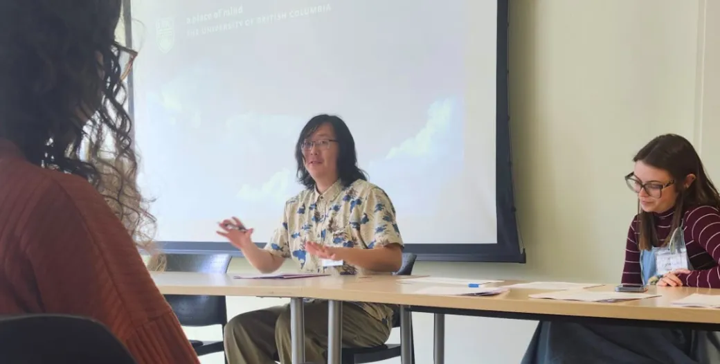 Wang, grad student, presenting at a conference