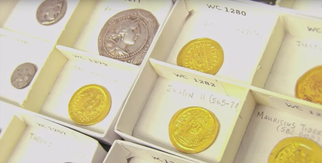 "Image of several late Roman coins in small boxes"
