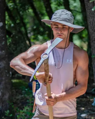 Held inspecting a pick axe
