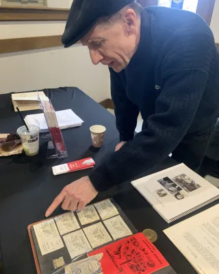 participant perusing Conrad memorabilia