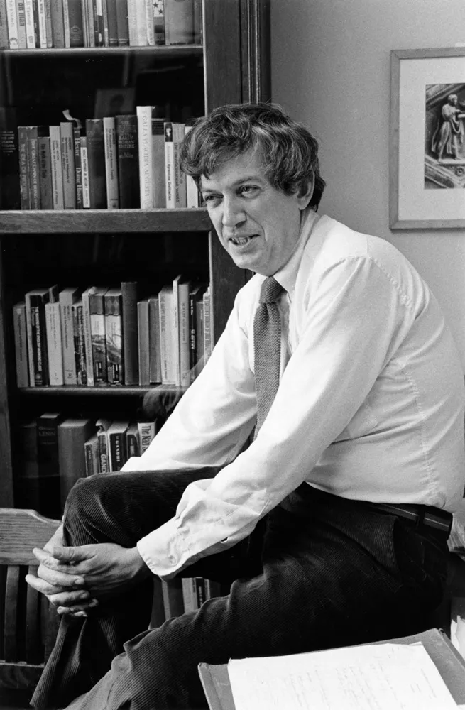 black and white picture of Redfield in front of a bookcase