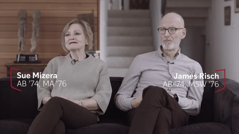 Two people sitting on a couch