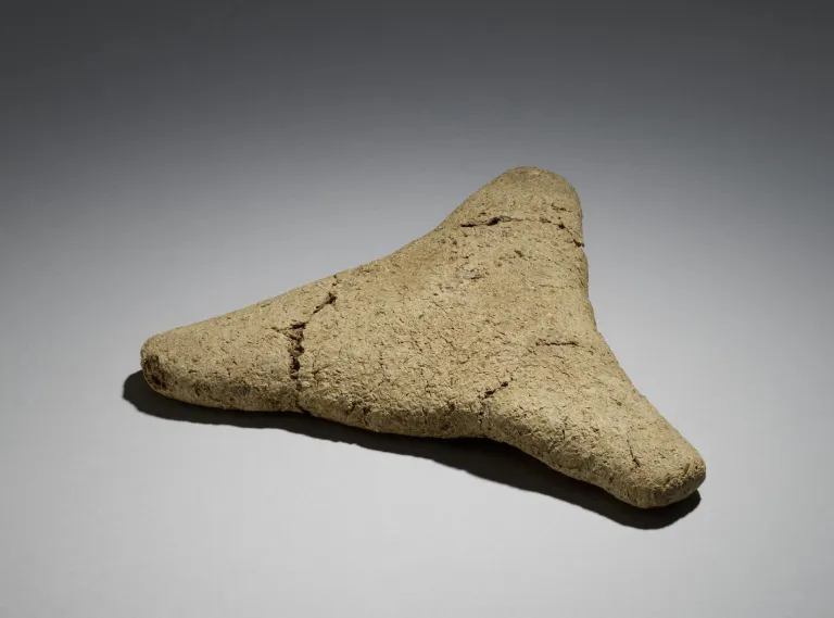 Tan and triangular object that is actually ancient bread
