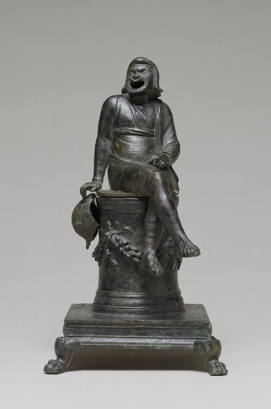 statue of Roman masked character