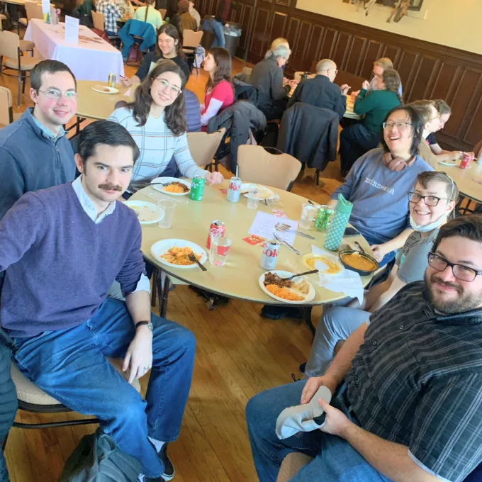 grad students sit at a table