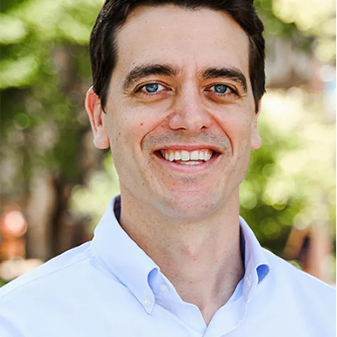 "Man standing before a blurred background in a professional photo"